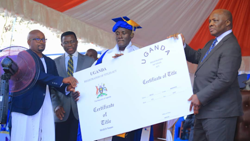 The Kabaka presenting a land title to the winner.